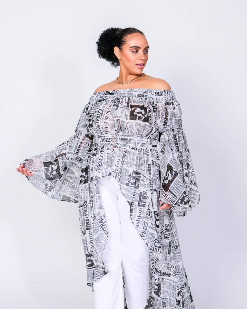 Front of a model wearing a size L (12/14) The Times Off The Shoulder Duster in Newspaper Print by LuvMeMore. | dia_product_style_image_id:266596